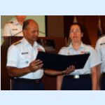 09 VADM Brown reading Merittorious Service Medal for Auxiliarist Penelope Soteria.jpg